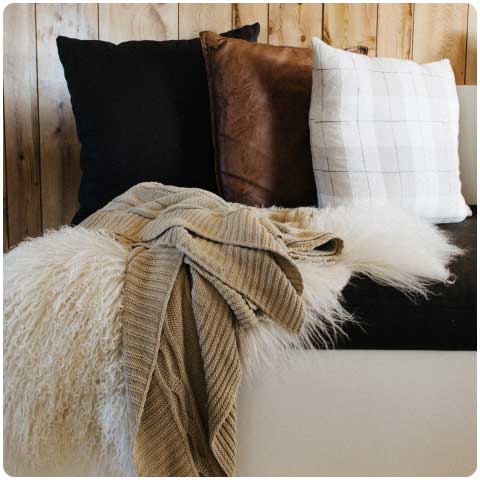 pillows and throw make a room cozy