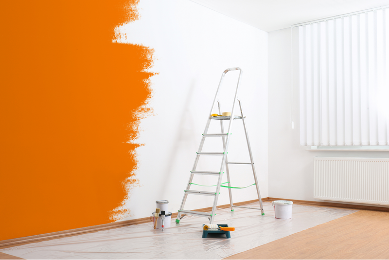 Covering Bold Paint orange painted wall being repainted with light colour