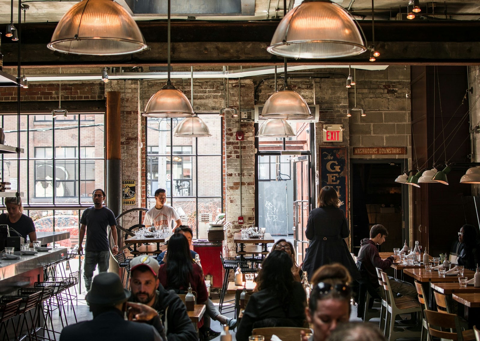 Chatting in a coffee shop photo by Nick Hillier, via Unsplash