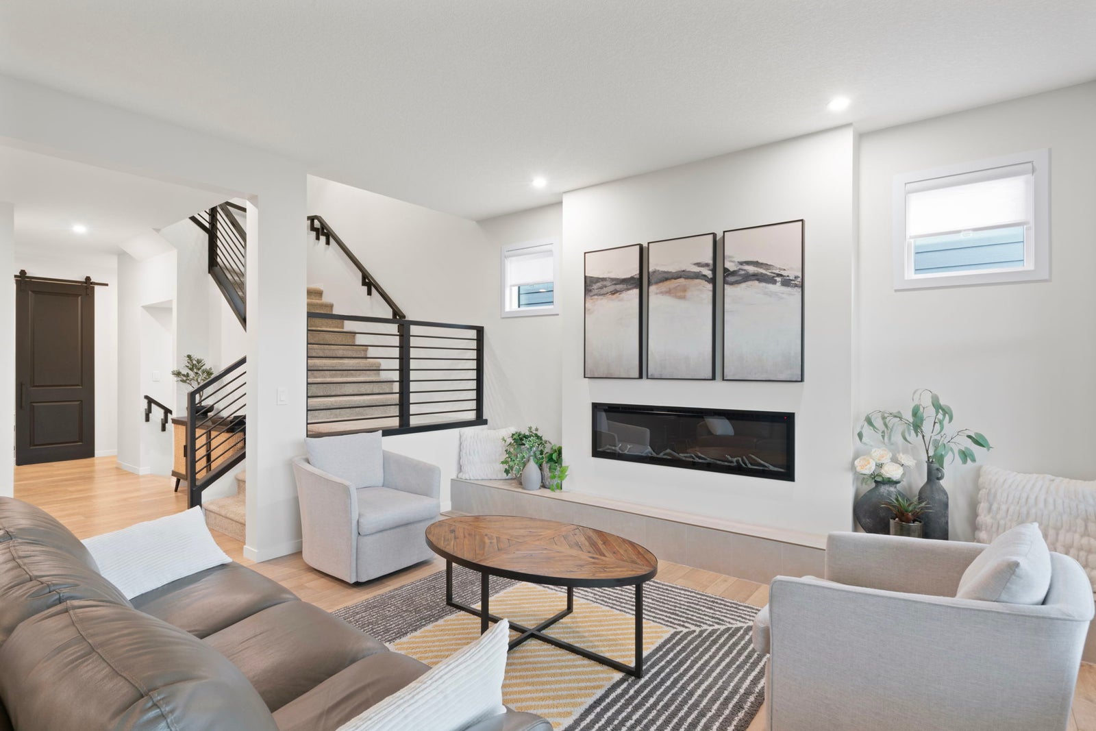 Beautiful living room with fireplace and custom railing