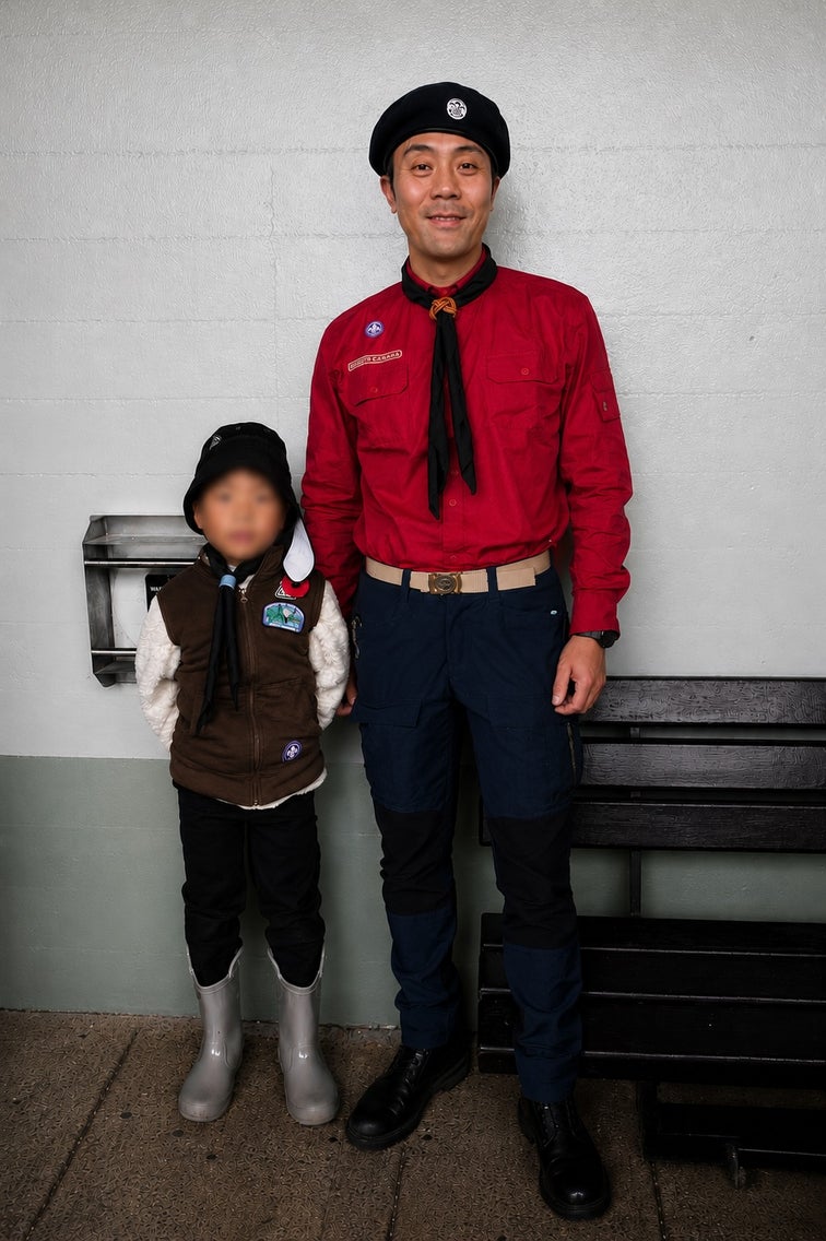Wilson Chiu volunteering as a Scouter with a Scouts Canada youth member during a remembrance day parade