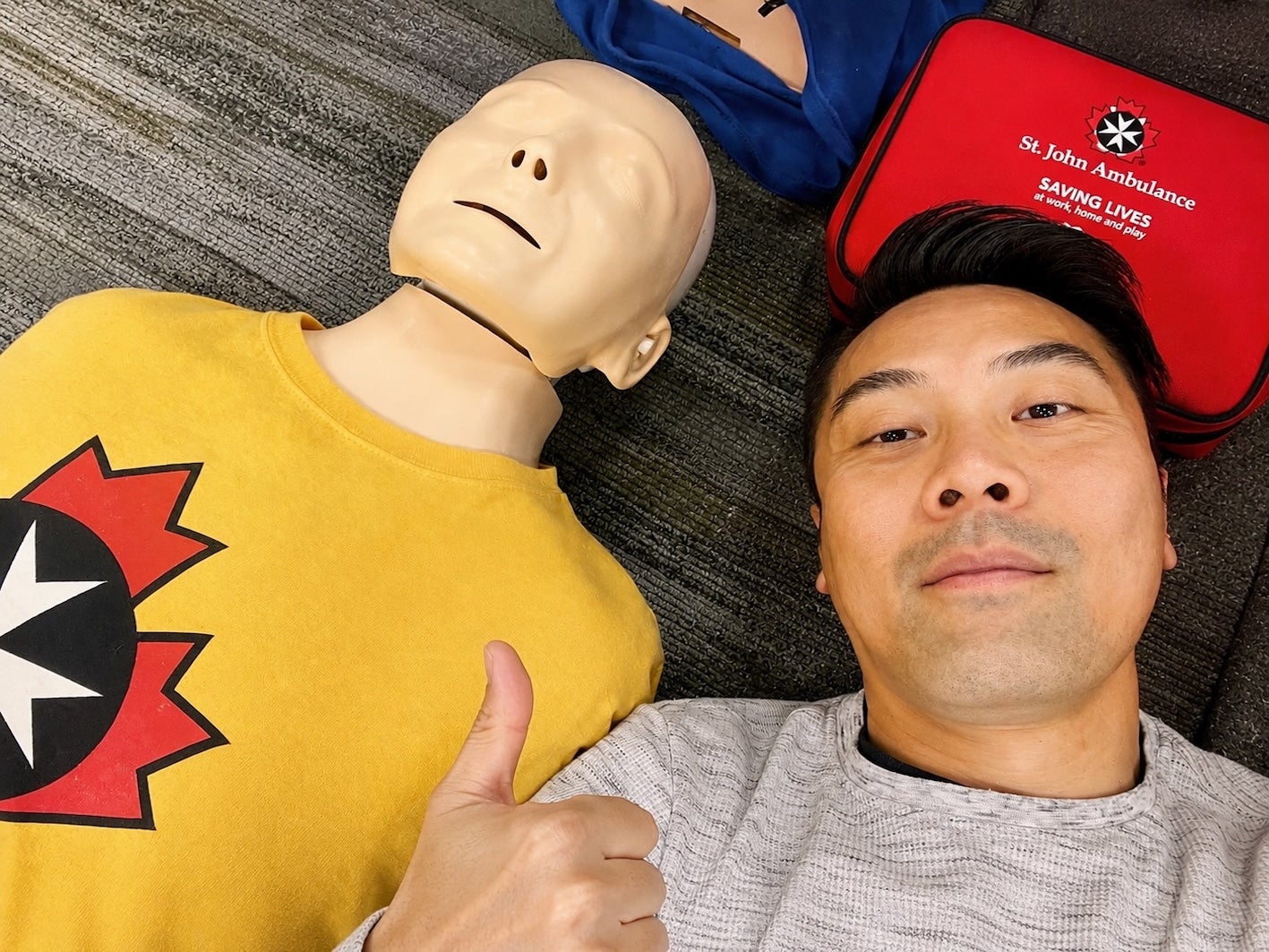 Wilson Chiu practicing CPR and first aid skills during Bronze Medallion certification training with the St. John Ambulance