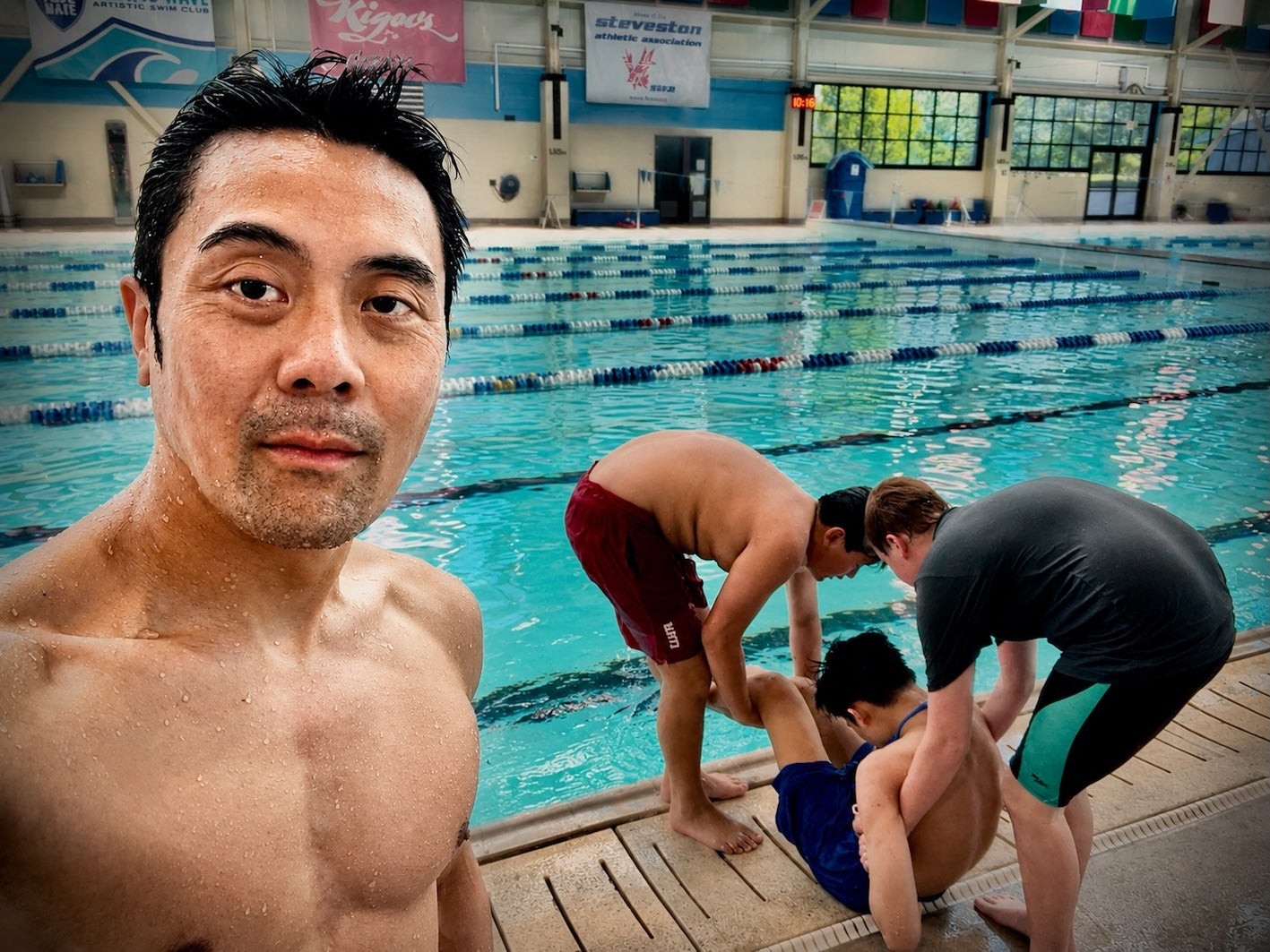 Wilson Chiu participating in Bronze Medallion rescue training, learning emergency response and lifesaving techniques at the pool.