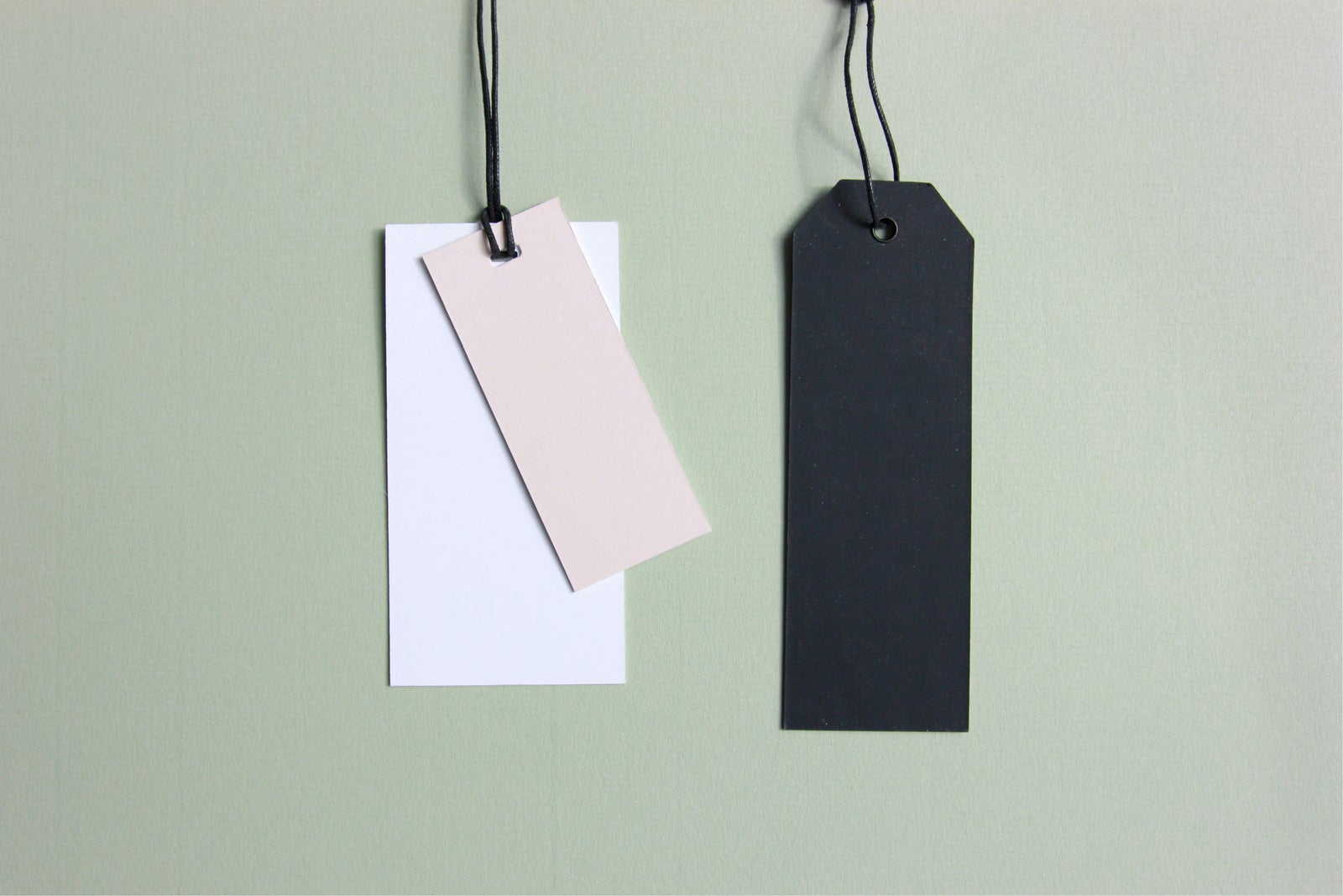 Hanging retail price tags representing listing price compared to final selling price in real estate.