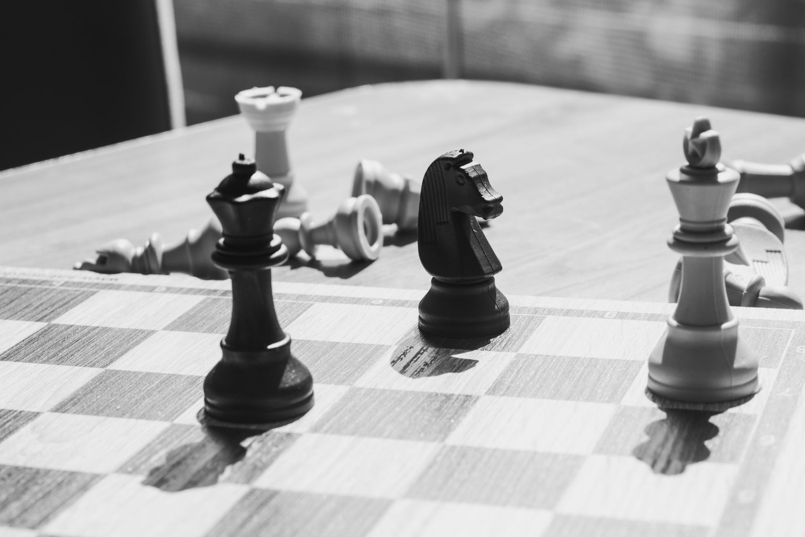 Chess pieces on a board illustrating the strategy behind pricing your home correctly in today's real estate market.