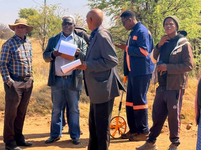 Property Valuer Darius Chifumba with land owners Mokwalale and Mosi village