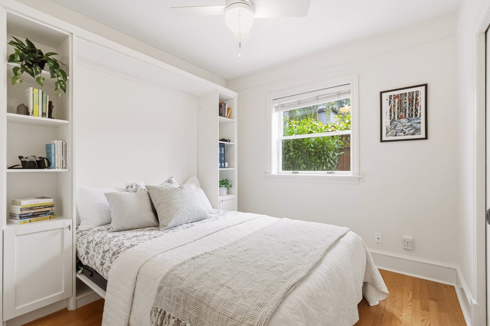 Second bedroom with new hardwood floors and ceiling fan at 1353 Grant Street