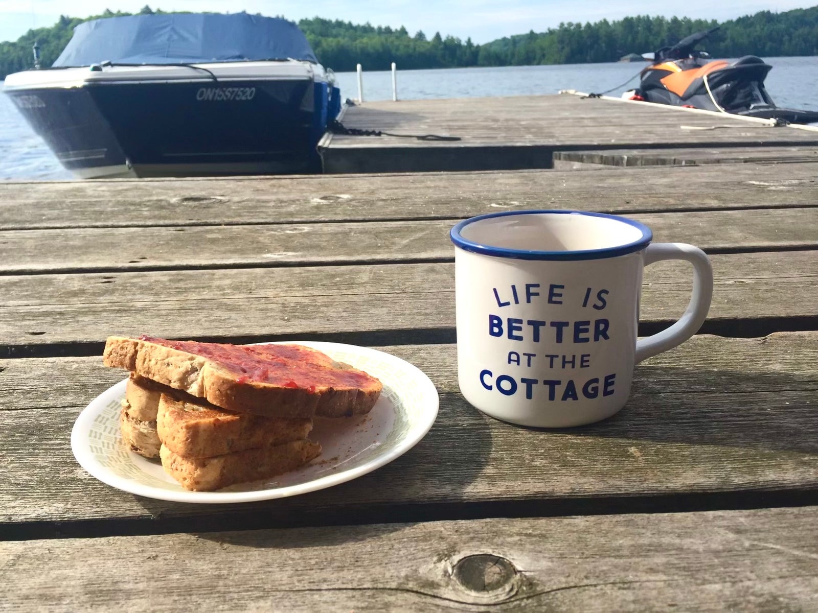 Coffee and breakfast on a dock in Muskoka Morning