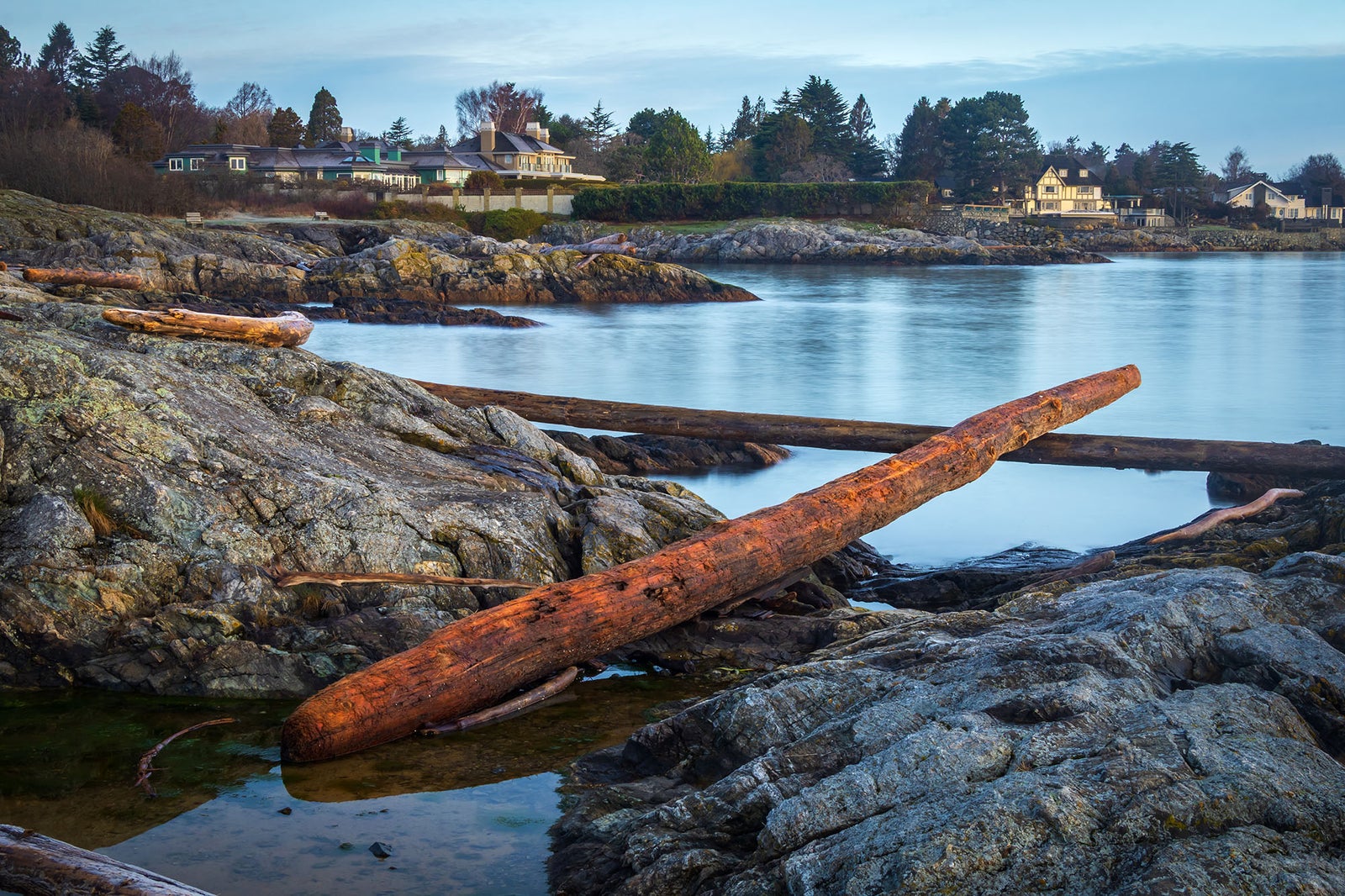Coastal homes along a rocky Central Vancouver Island shoreline