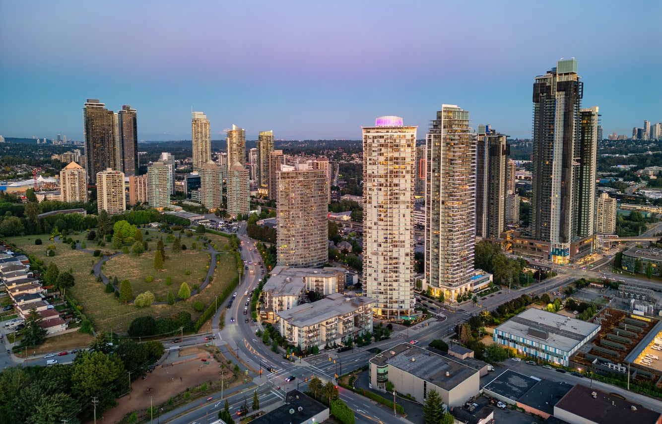 Aerial view of Brentwood's skyline featuring modern high-rise buildings and green spaces, showcasing prime Brentwood real estate opportunities