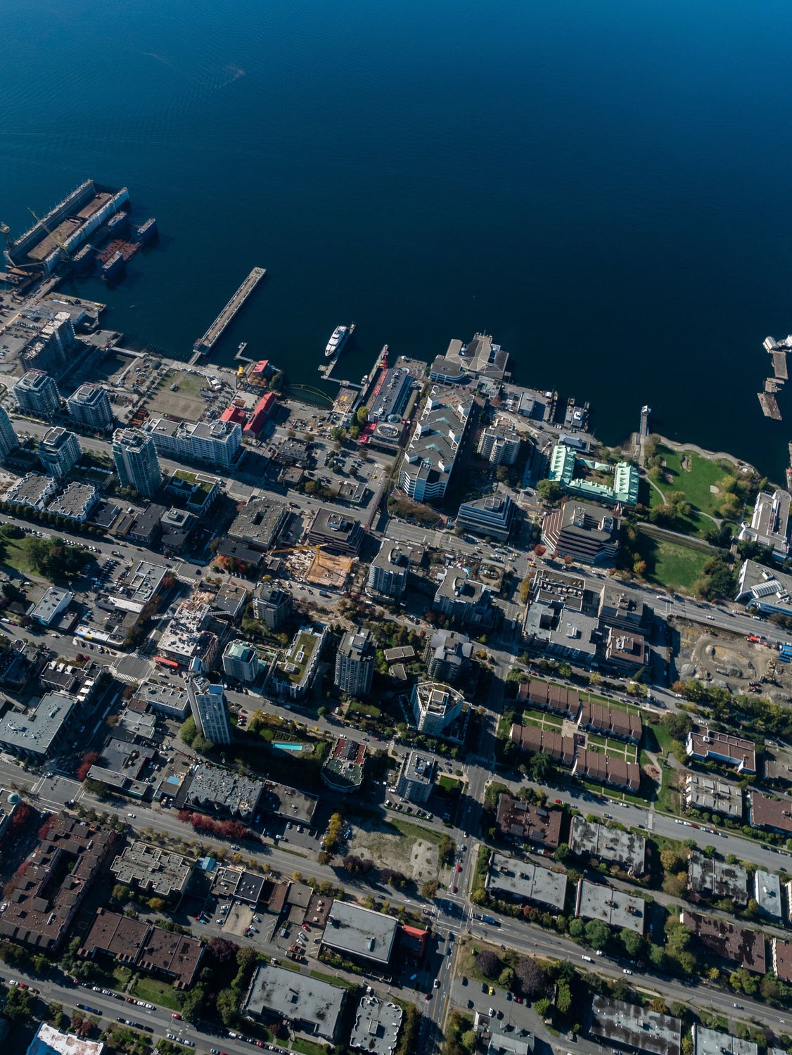 Aerial view of Lower Lonsdale's waterfront and urban landscape, illustrating prime real estate opportunities and residential areas for those seeking a trusted Lower Lonsdale Realtor.