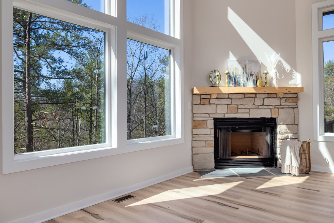Bright living room with forest views (stock photo)