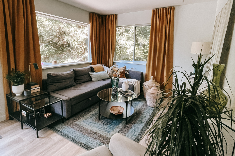 Staged Living Room with Grey Couch Mustard Curtains