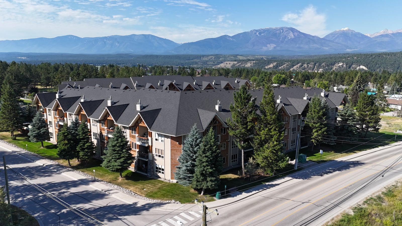 Sable Ridge condo building on Columbia Avenue in Radium Hot Springs, BC, with mountains behind