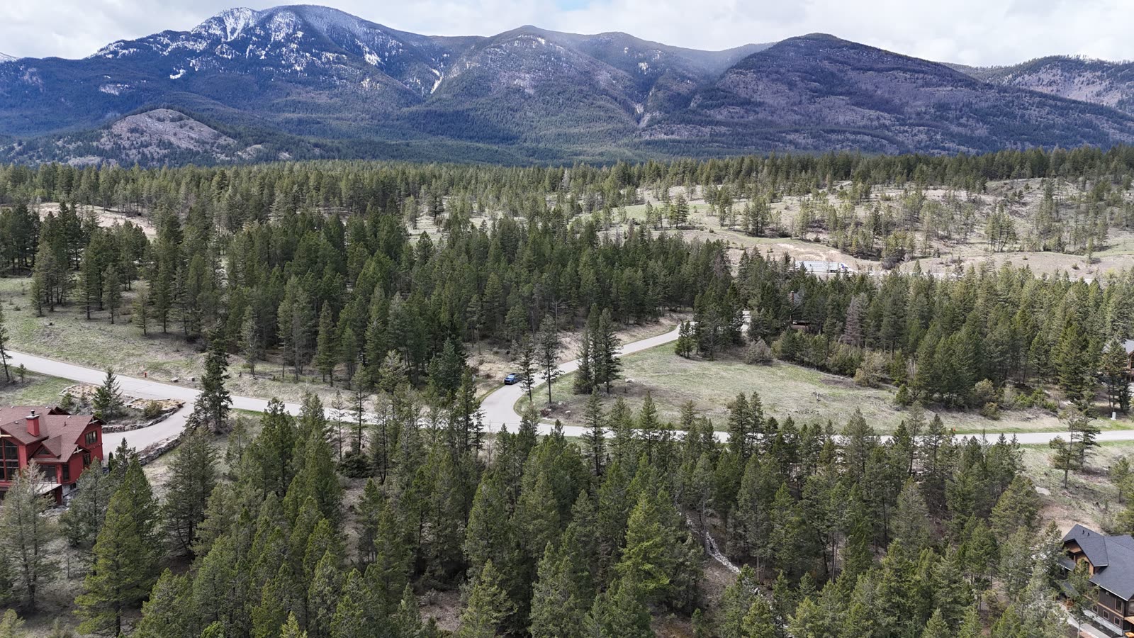 A vacant building lot with Rocky Mountain views at Fairmont Hot Springs, BC, where vacant land purchases typically require 50% down