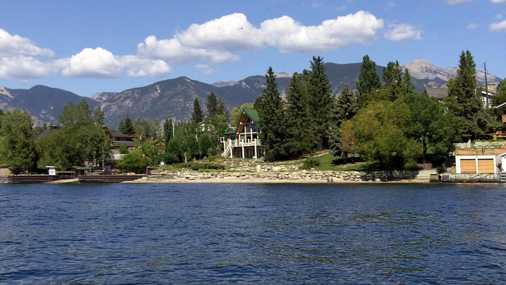 Lakefront front home with Rocky mountains in background Windermere legacy estate – Quiet luxury in the Columbia Valley
