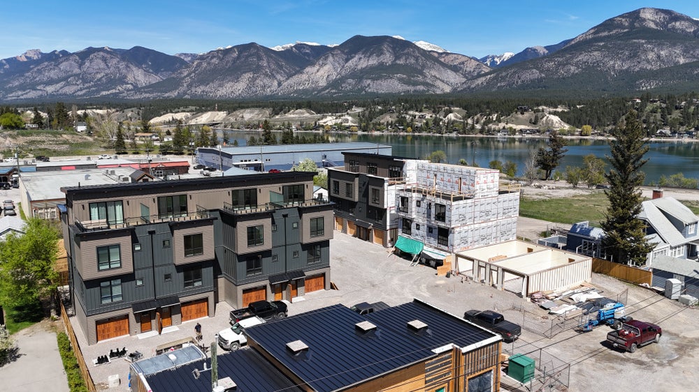Vista Heights Invermere Townhome complex near Lake Windermere with downtown views and mountain backdrop, highlighting luxury living and prime location.