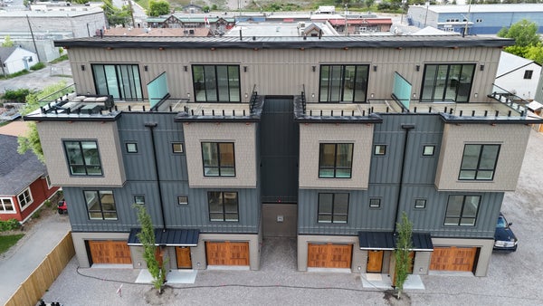 Modern Invermere townhome at Vista Heights, featuring rooftop patios, wood accents, and central location near local amenities.