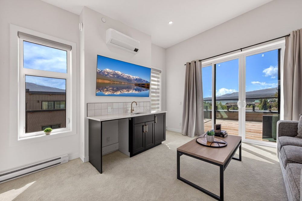 Fourth Level Vista Heights Invermere luxury townhome fourth level lounge with wet bar and rooftop patio access