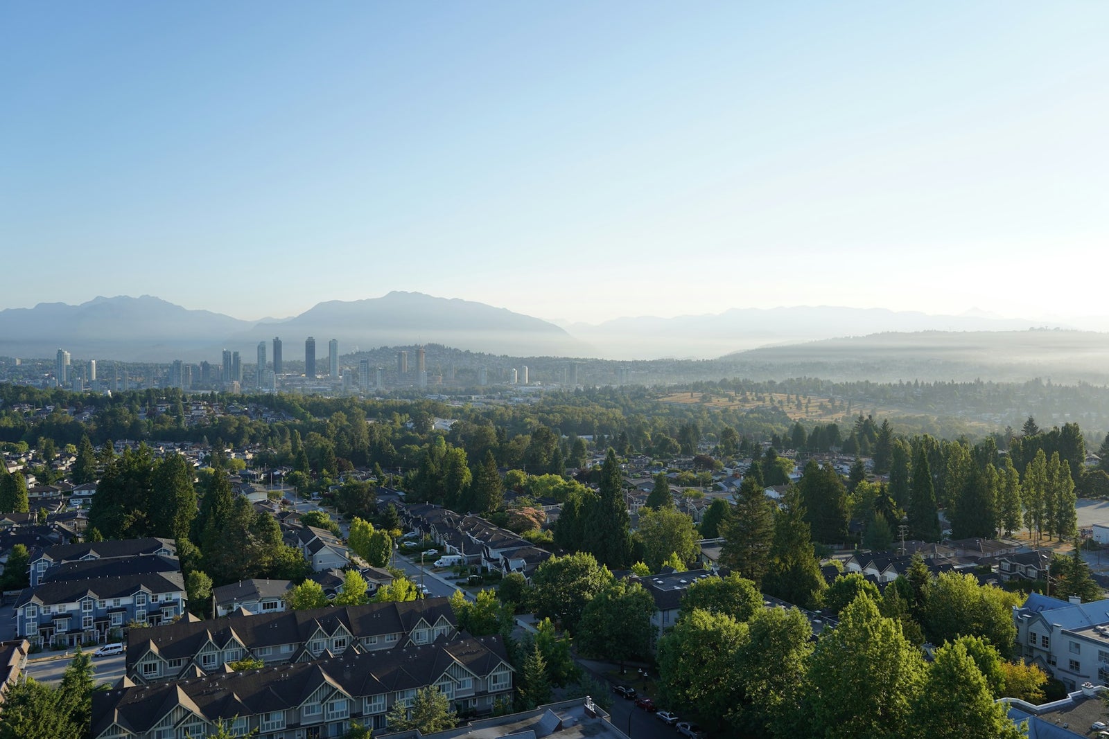 Burnaby skyline and residential homes with mountain views - My Dream Realty property management Burnaby