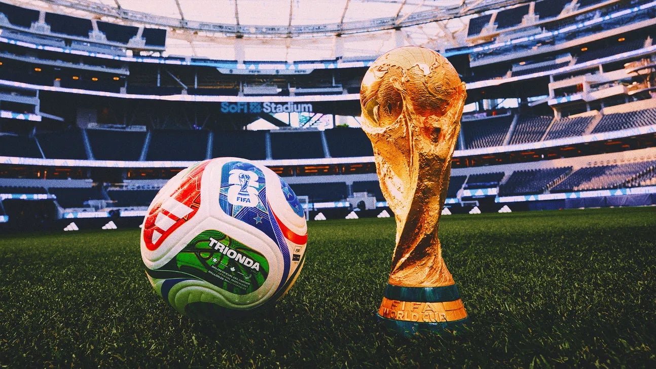 FIFA World Cup trophy and official match ball on the field inside a stadium, symbolizing Vancouver FIFA 2026 property management and rentals