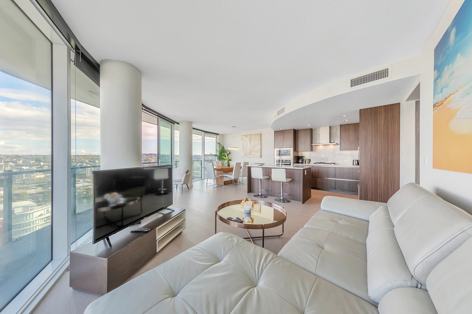 Modern furnished rental condo in Vancouver with city views and open-concept kitchen