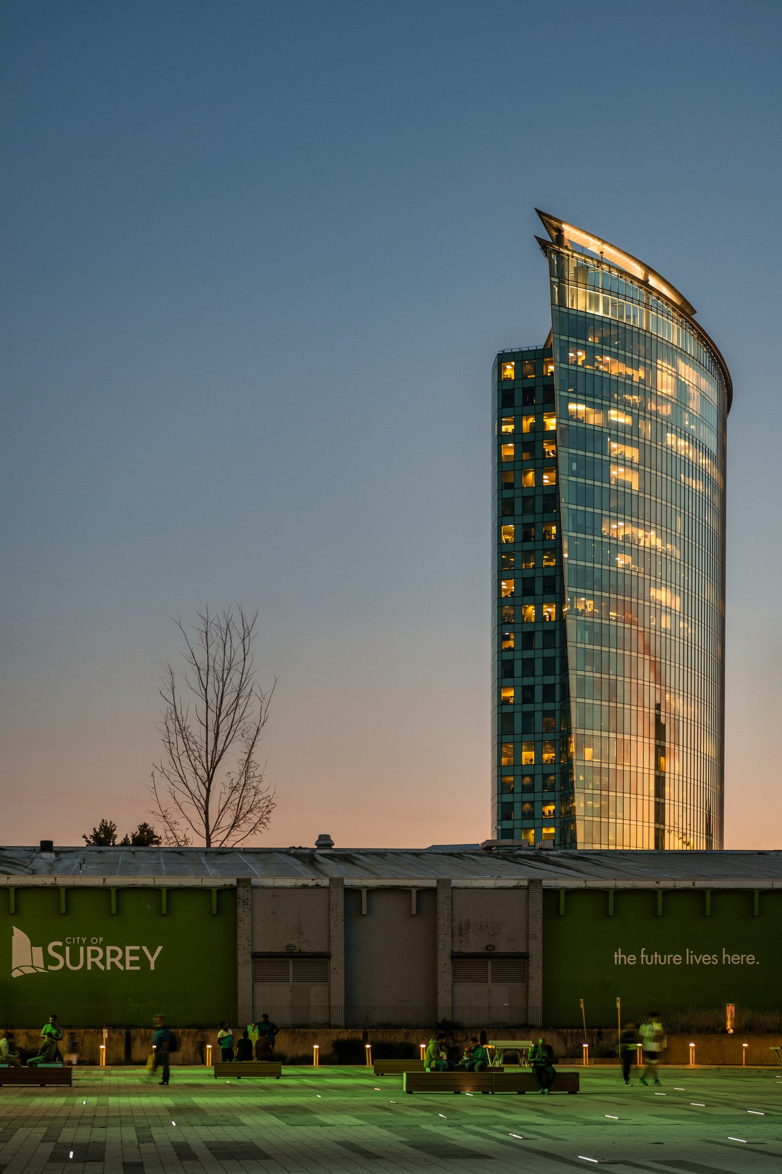 Surrey City Hall and Civic Plaza at dusk, showcasing Surrey’s modern skyline and growing urban community.