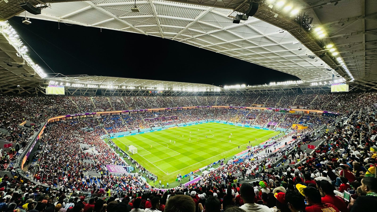 Full stadium with thousands of fans watching a FIFA World Cup match - Vancouver BC Place hosting FIFA 2026