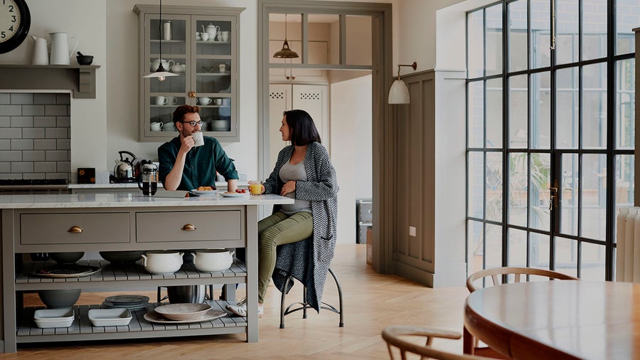 young couple at table having coffee