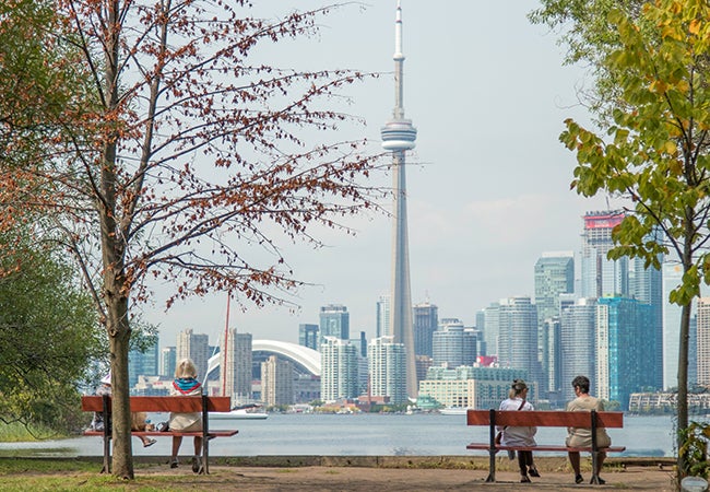 Bernie and Julia on a bench on Toronto Island looking at downtown